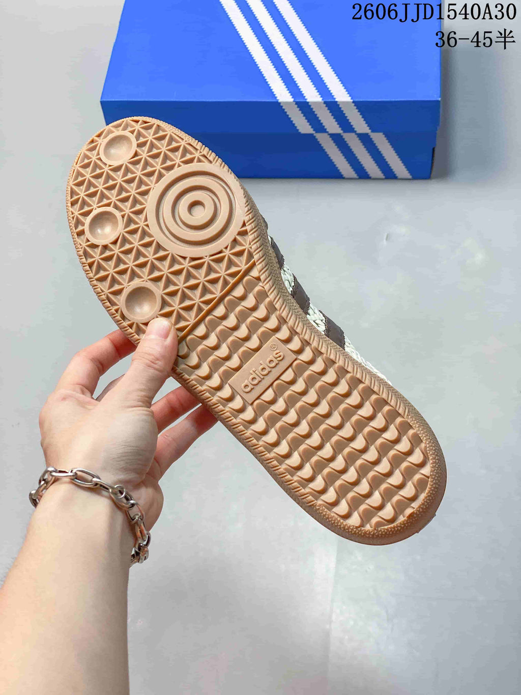 Close-up of the gum-colored sneaker outsole and patterned tread