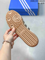 Close-up of the gum-colored sneaker outsole and patterned tread