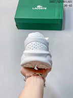 Rear view showing the heel and thick sole of a white sneaker