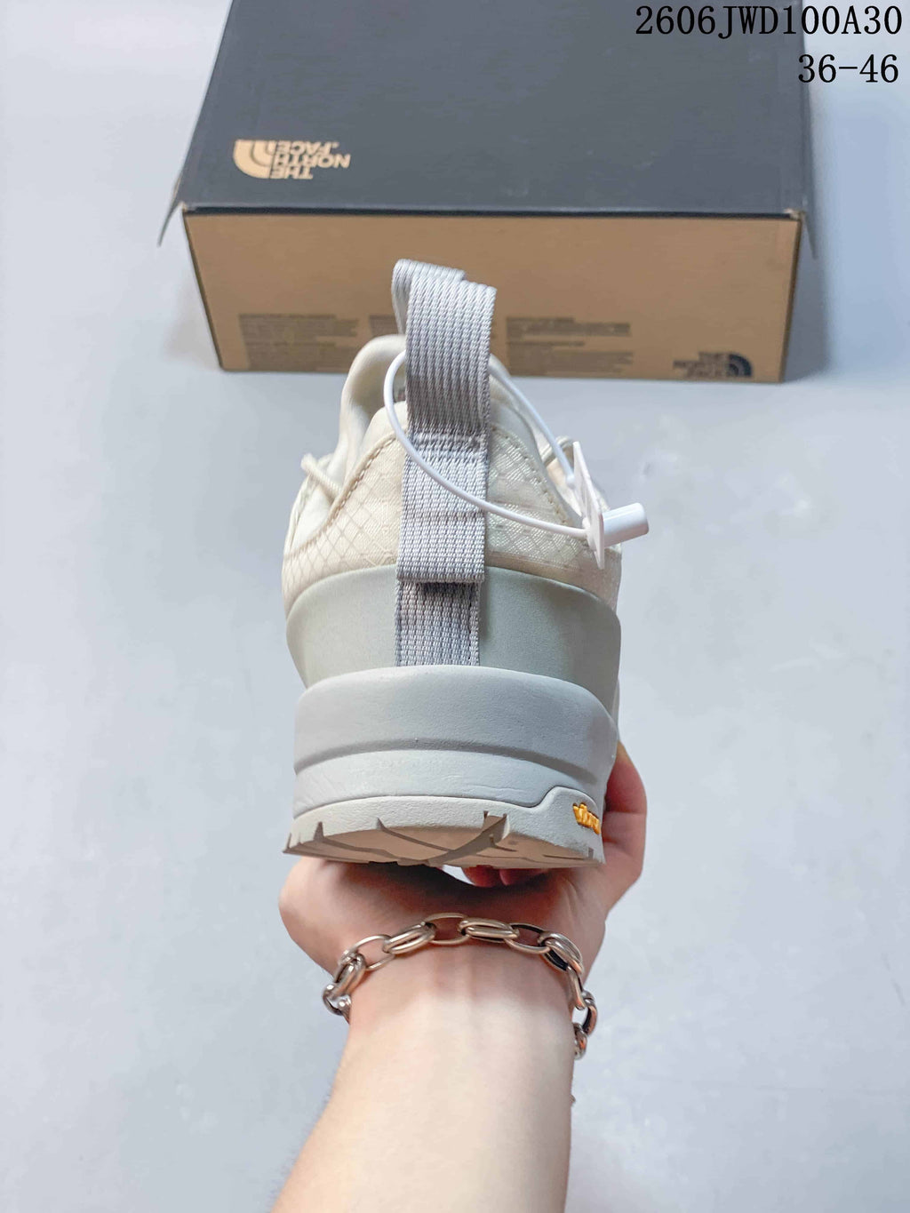 Rear view showing the heel pull tab and layered sole