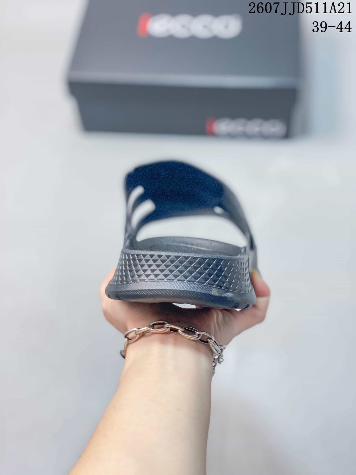 Rear view of a gray sandal showing the textured heel area and open construction.