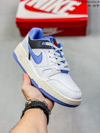 Angled side view of the Nike Full Force LO sneaker showing the white upper, blue Swoosh, black collar detail and textured blue outsole.