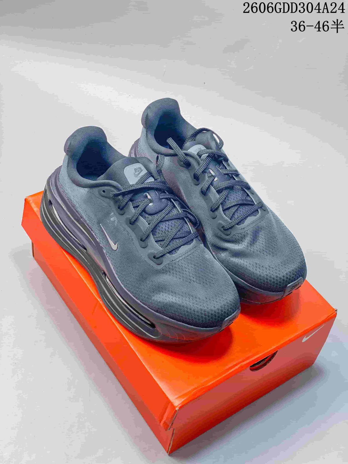 Pair of black Nike Vomero Premium SP running shoes on an orange shoe box