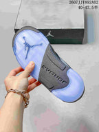 Underside of the sneaker showing a translucent blue outsole and dark center panel