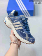 Navy blue adidas Response CL sneaker with cream-colored side stripes and a chunky off-white sole.