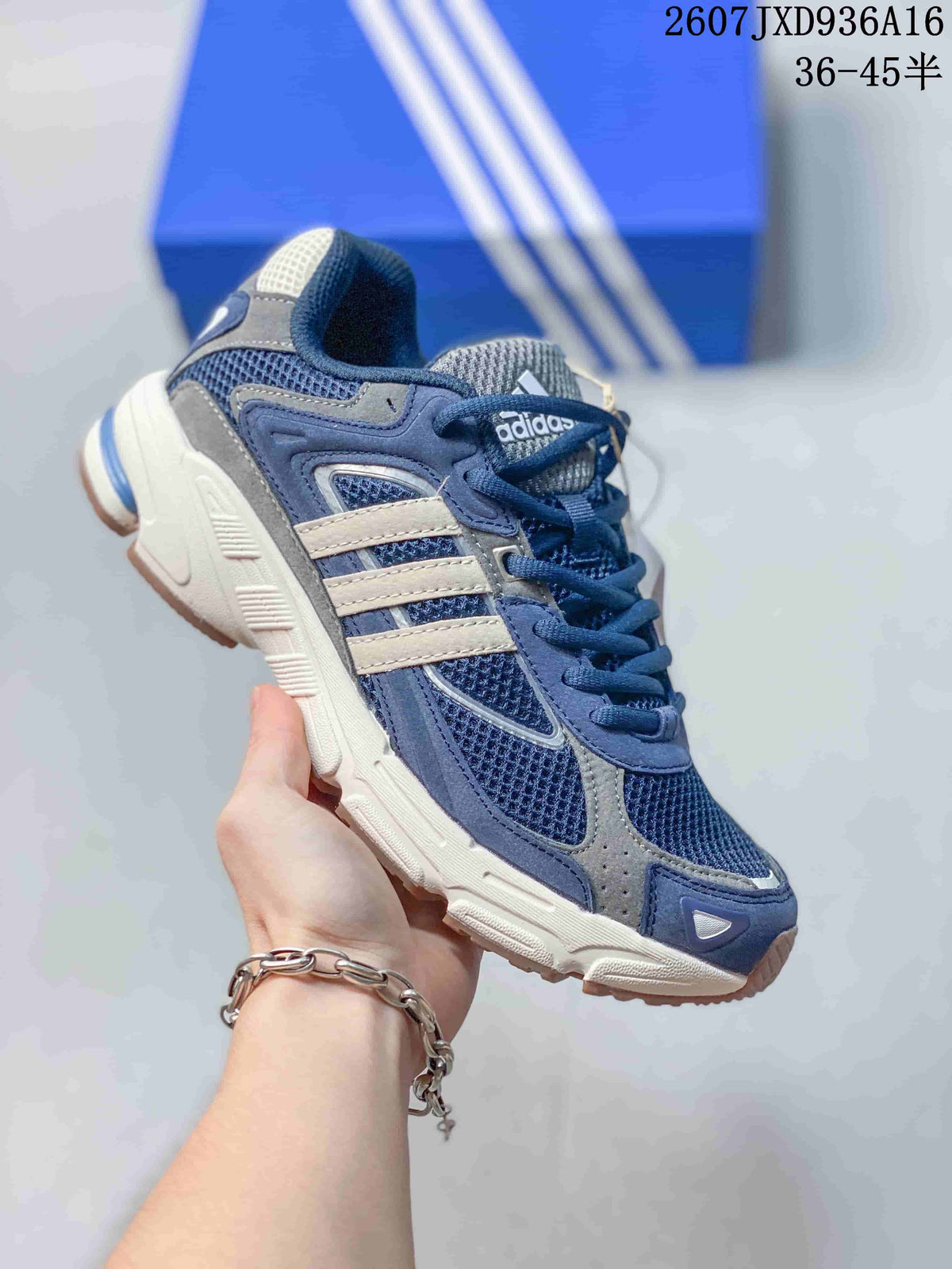 Navy blue adidas Response CL sneaker with cream-colored side stripes and a chunky off-white sole.