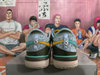 Rear view of light blue Nike basketball shoes with teal trim, dark heel panels, and yellow accents