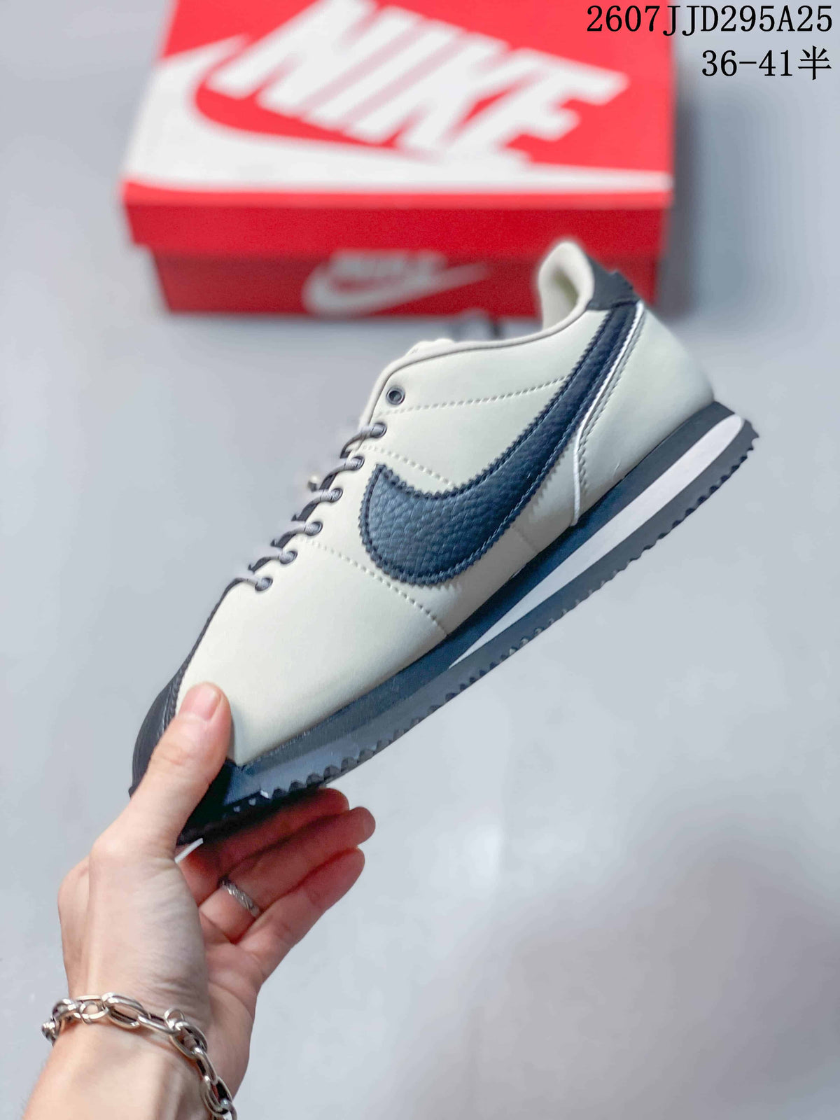 Side profile showing the low-top silhouette, contrast Swoosh, layered midsole, and ridged outsole.
