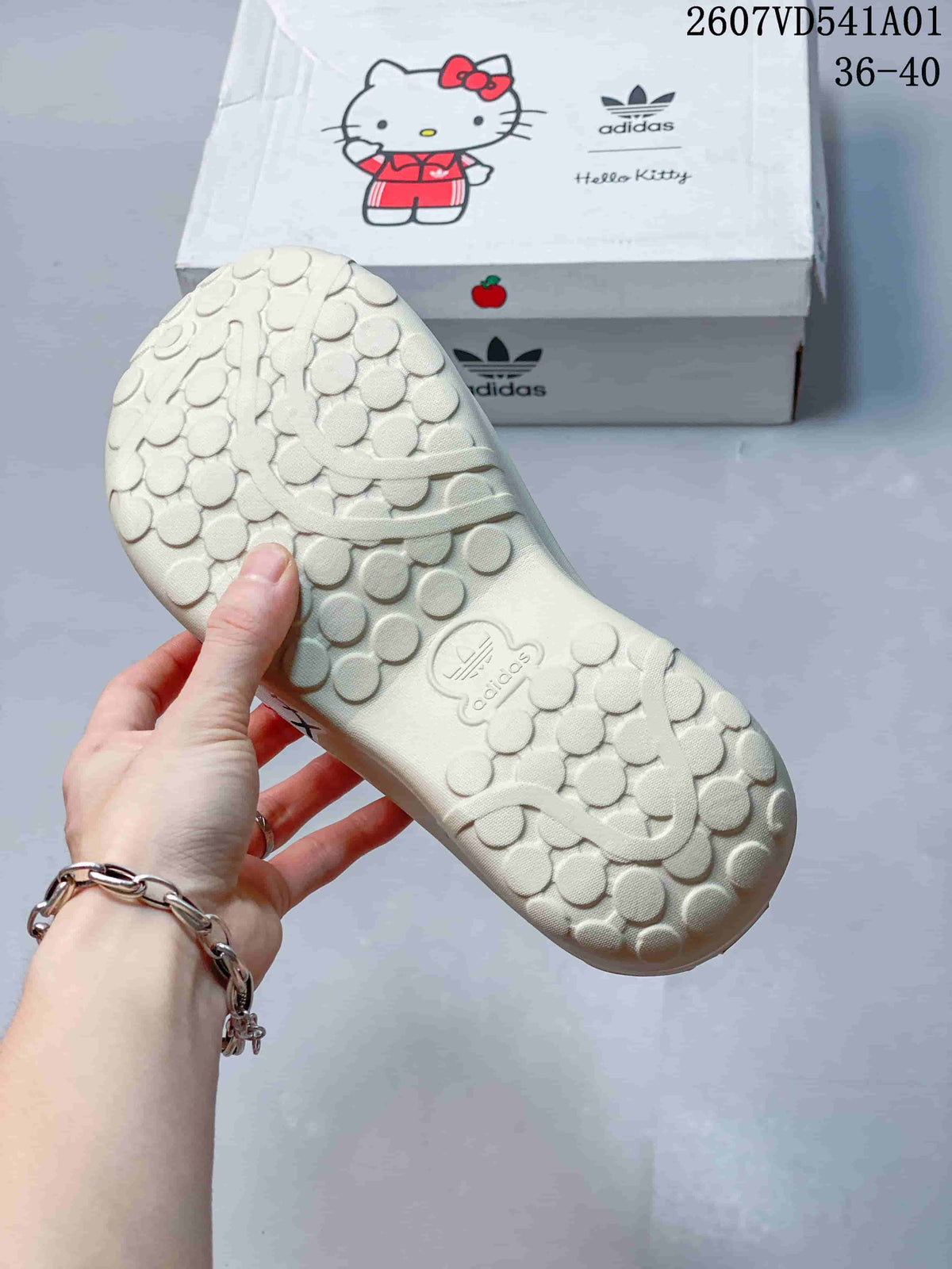 Underside of a cream mule clog showing its patterned sole and adidas branding