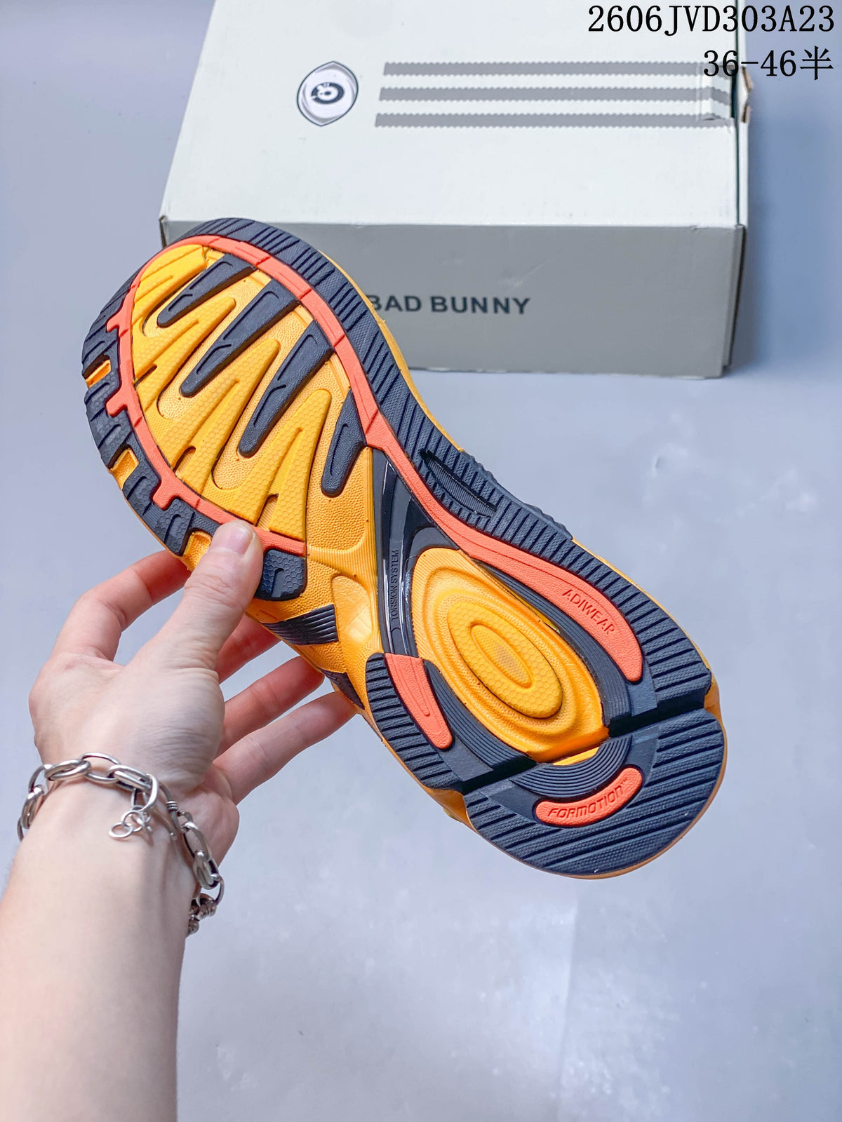 Close-up of the sneakers’ yellow, orange, and navy patterned outsole