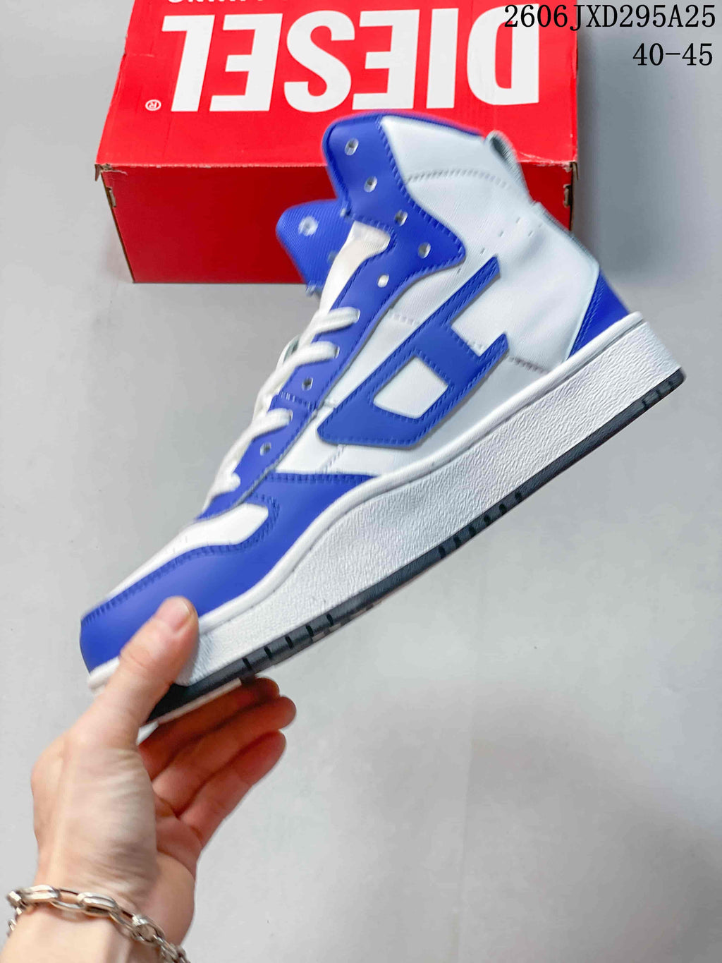 Side view of the white and blue high-top sneaker