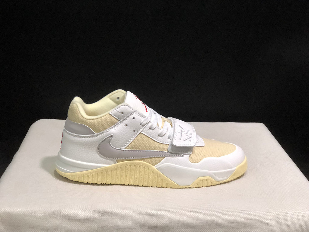 Single sneaker side profile highlighting the grey Swoosh, cream toe panel, strap and textured outsole.