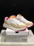 Pair of white, beige and pink low-top Off-White sneakers shown from a front three-quarter angle on a shoebox; the box label shows size 41.