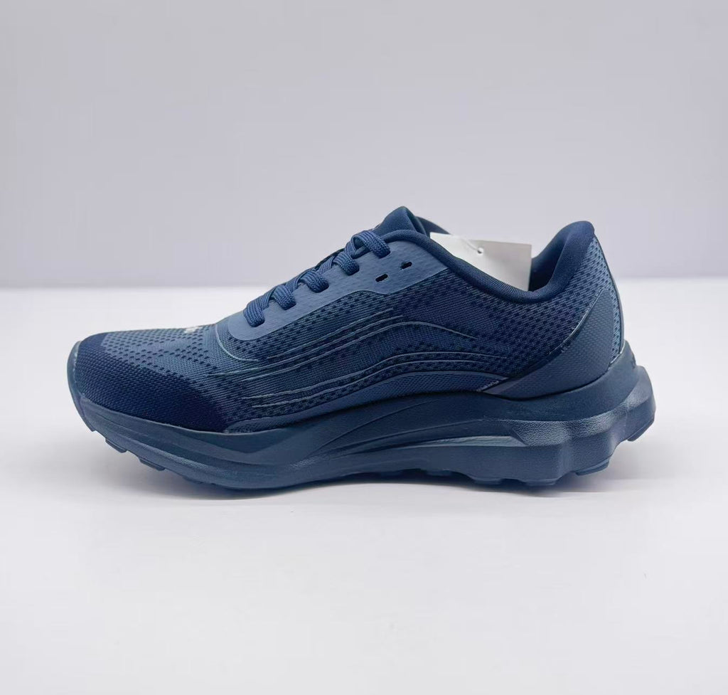 Opposite side view of the dark blue Alo sneaker with a padded collar, lace-up design, and textured outsole.