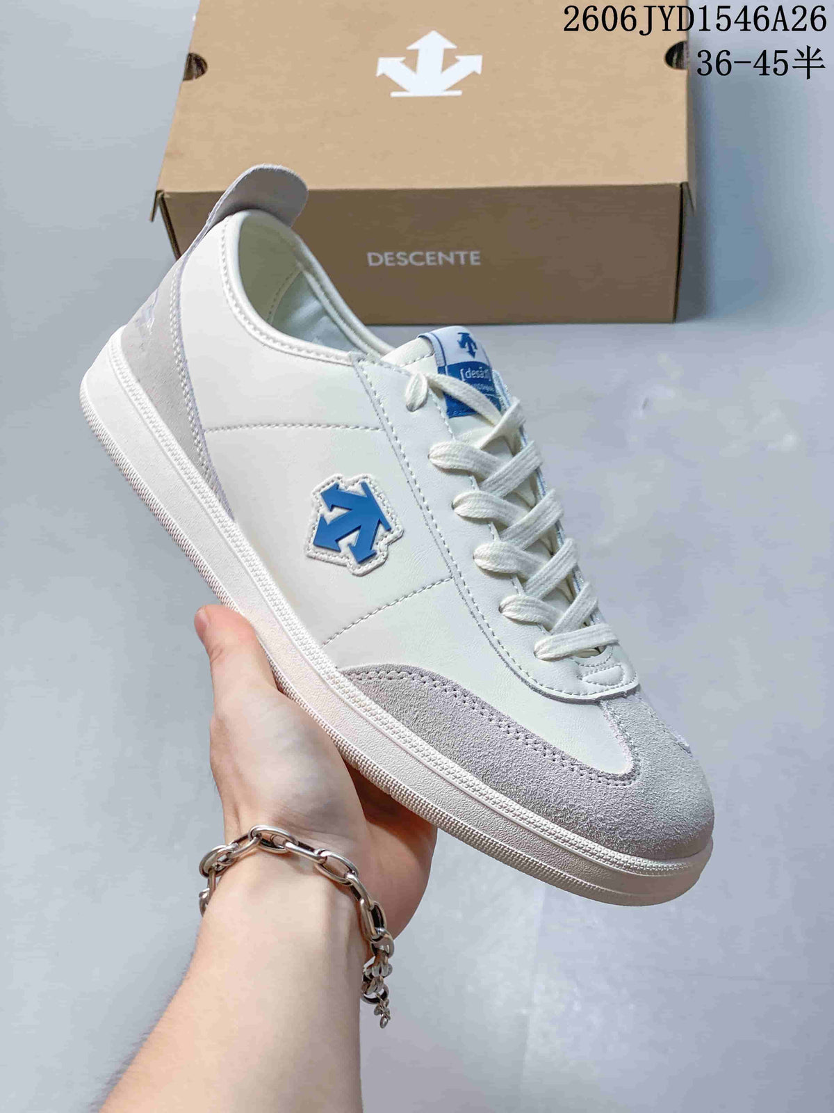 Close-up of a white and gray low-top sneaker with blue side emblem and laces