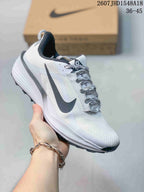 White Nike ReactX Pegasus ACG Trail 6 sneaker with black detailing and patterned laces.