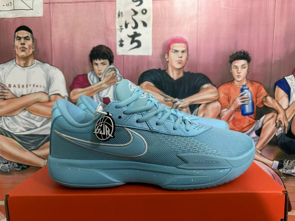 Side profile of a blue Nike basketball sneaker showing the Swoosh, mesh-textured upper, padded collar, and rubber outsole.