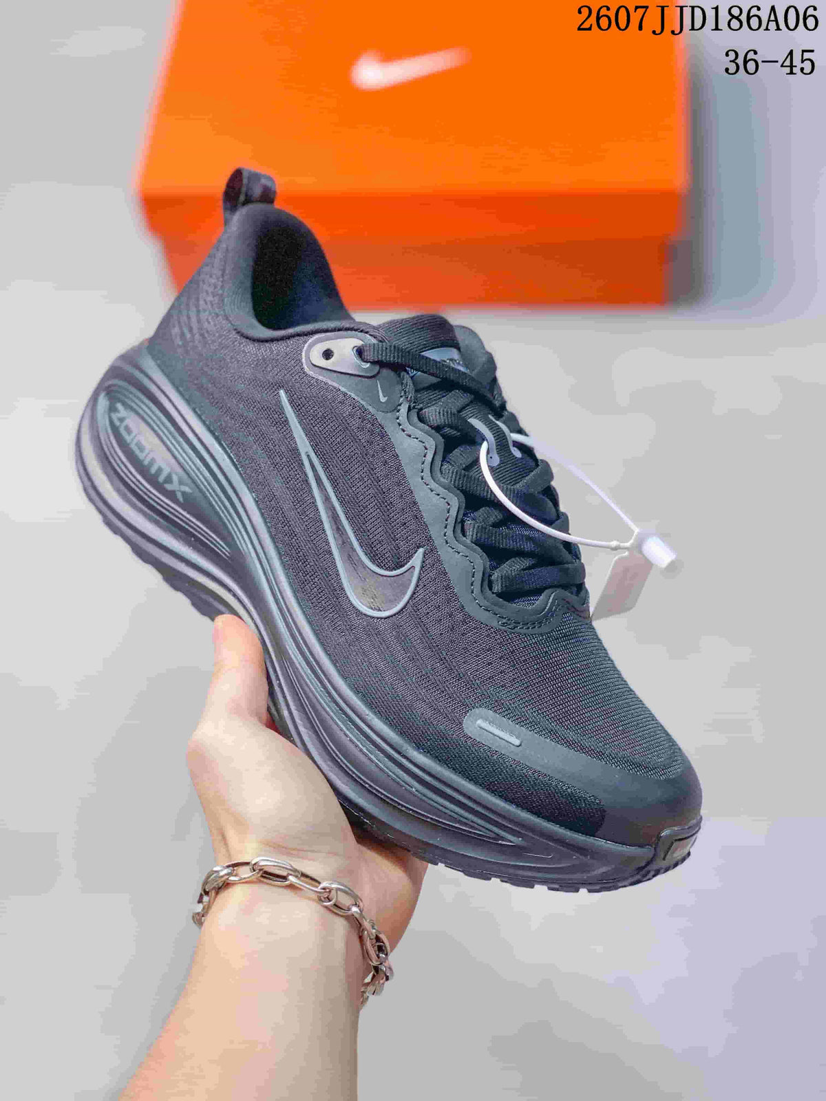 Angled side view showing the dark upper, Nike Swoosh, laces, and raised midsole.