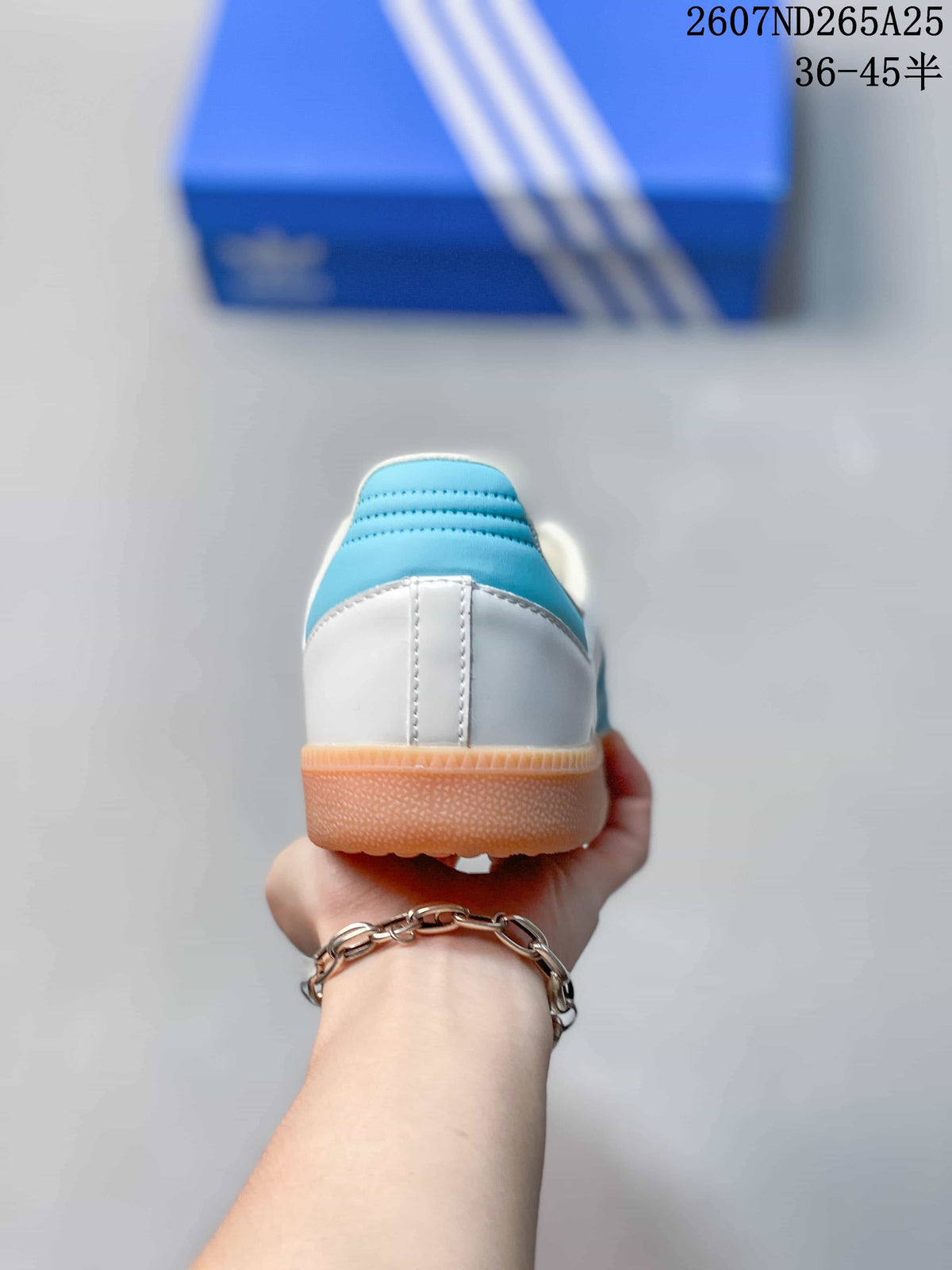 Rear view showing the white heel, blue heel collar detail, and gum outsole.