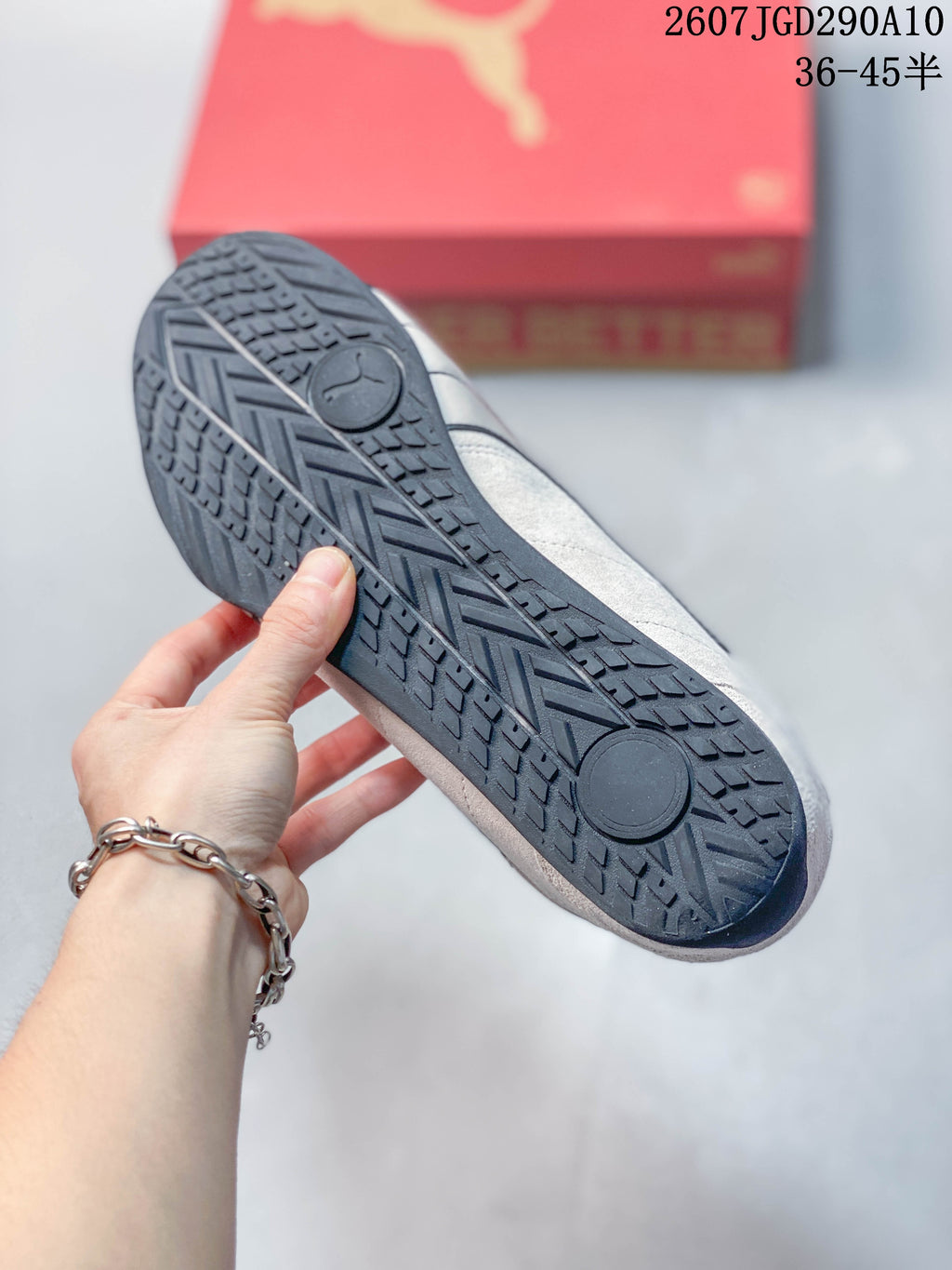 Close view of the dark rubber outsole showing its patterned tread and Puma logo.