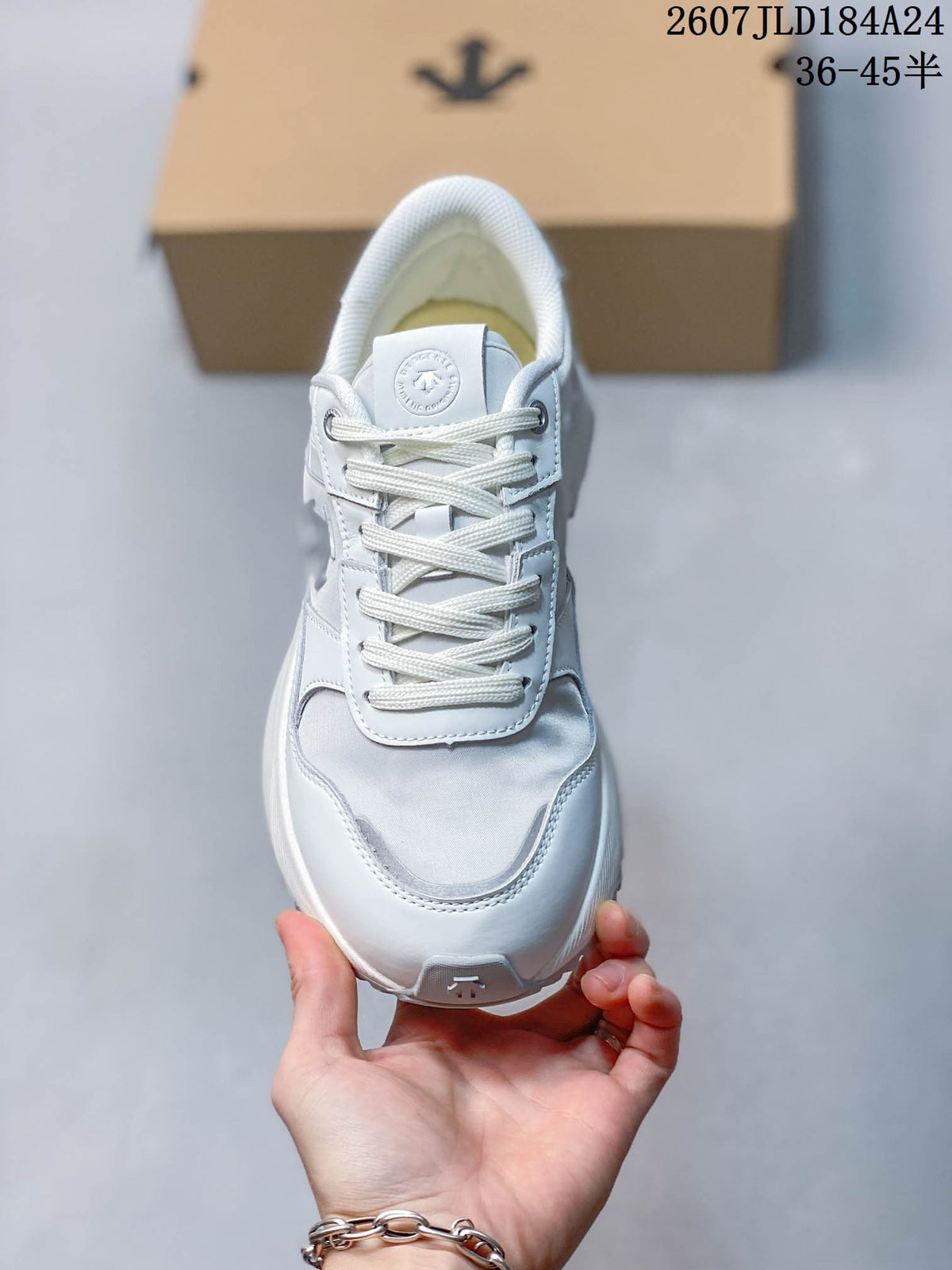 Top view of the white lace-up sneaker showing the tongue, eyelets, toe panel and padded collar.
