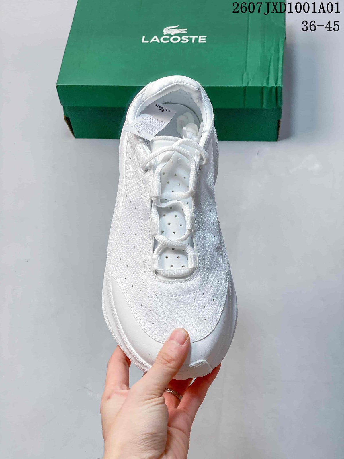Top view of a white lace-up sneaker with perforated panels