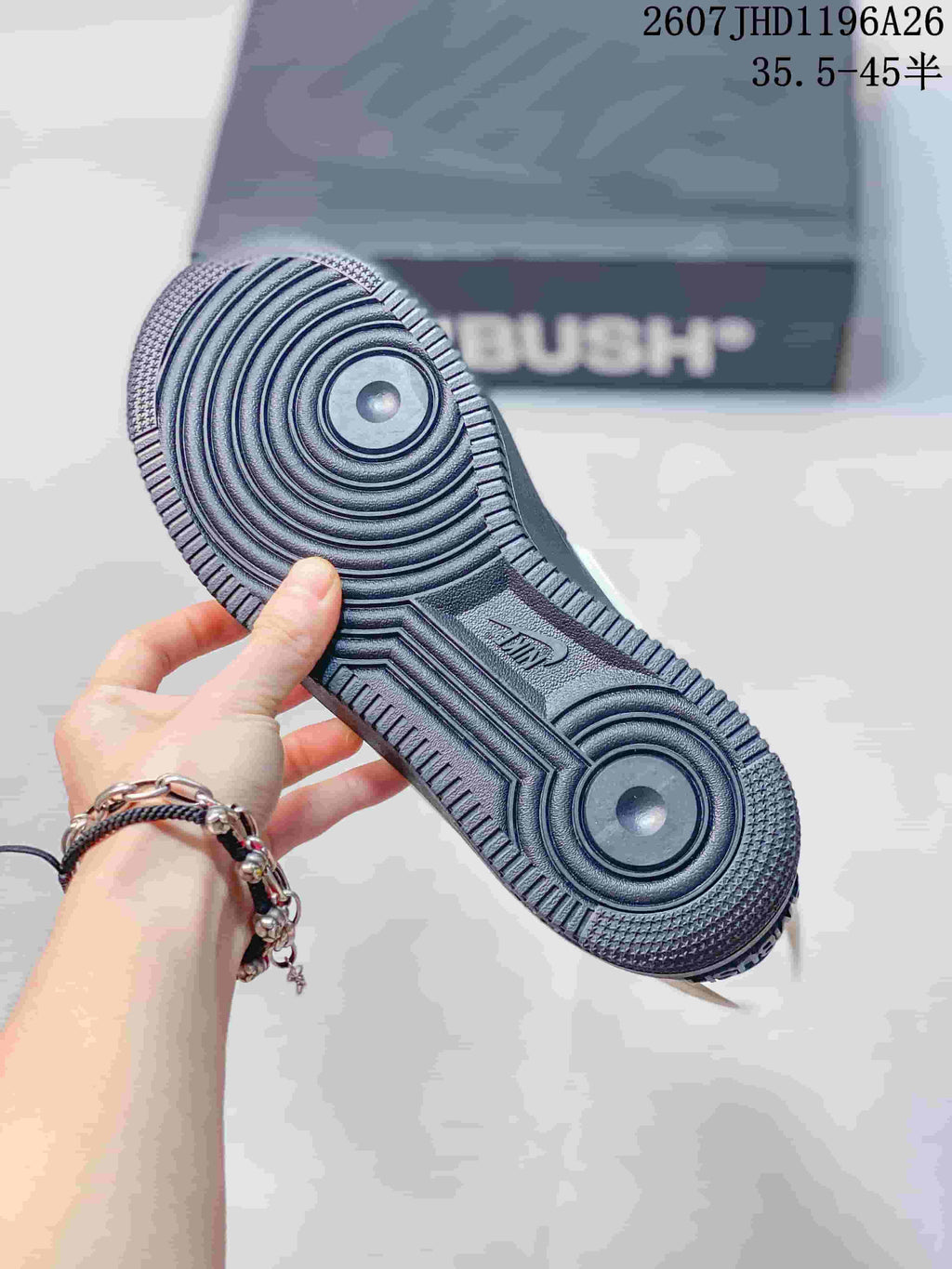 Close-up of the textured black rubber outsole with circular traction patterns.