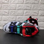 Top view highlighting the black tongue and red, aqua, and blue straps