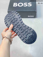 Close-up of the gray sneaker outsole showing its deep patterned tread.