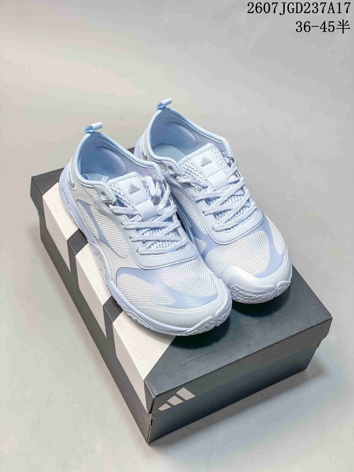 Pair of crystal blue adidas FOS GROUNDFLOW sneakers displayed on an adidas shoebox.