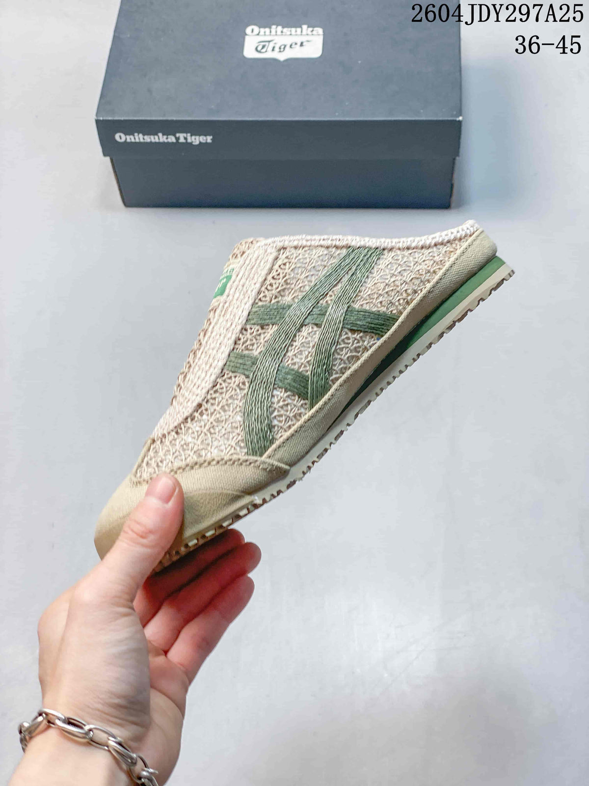 Side profile of the beige sneaker showing green side stripes and the textured outsole.