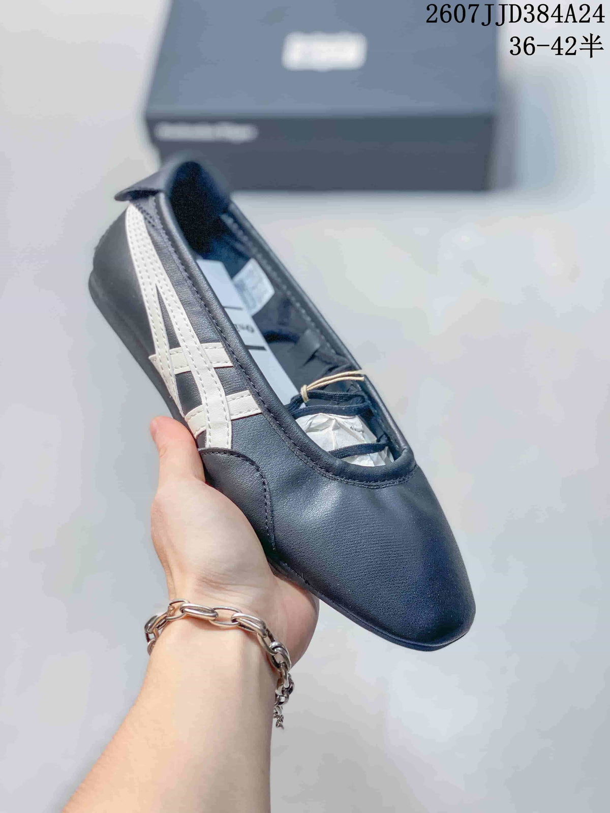 Angled side view of the dark navy Mary Jane-style shoe with white side stripes and rounded toe.