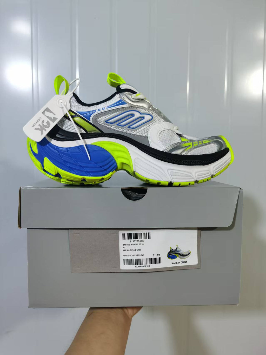 Side view of the chunky sneaker on its box with the visible size label.