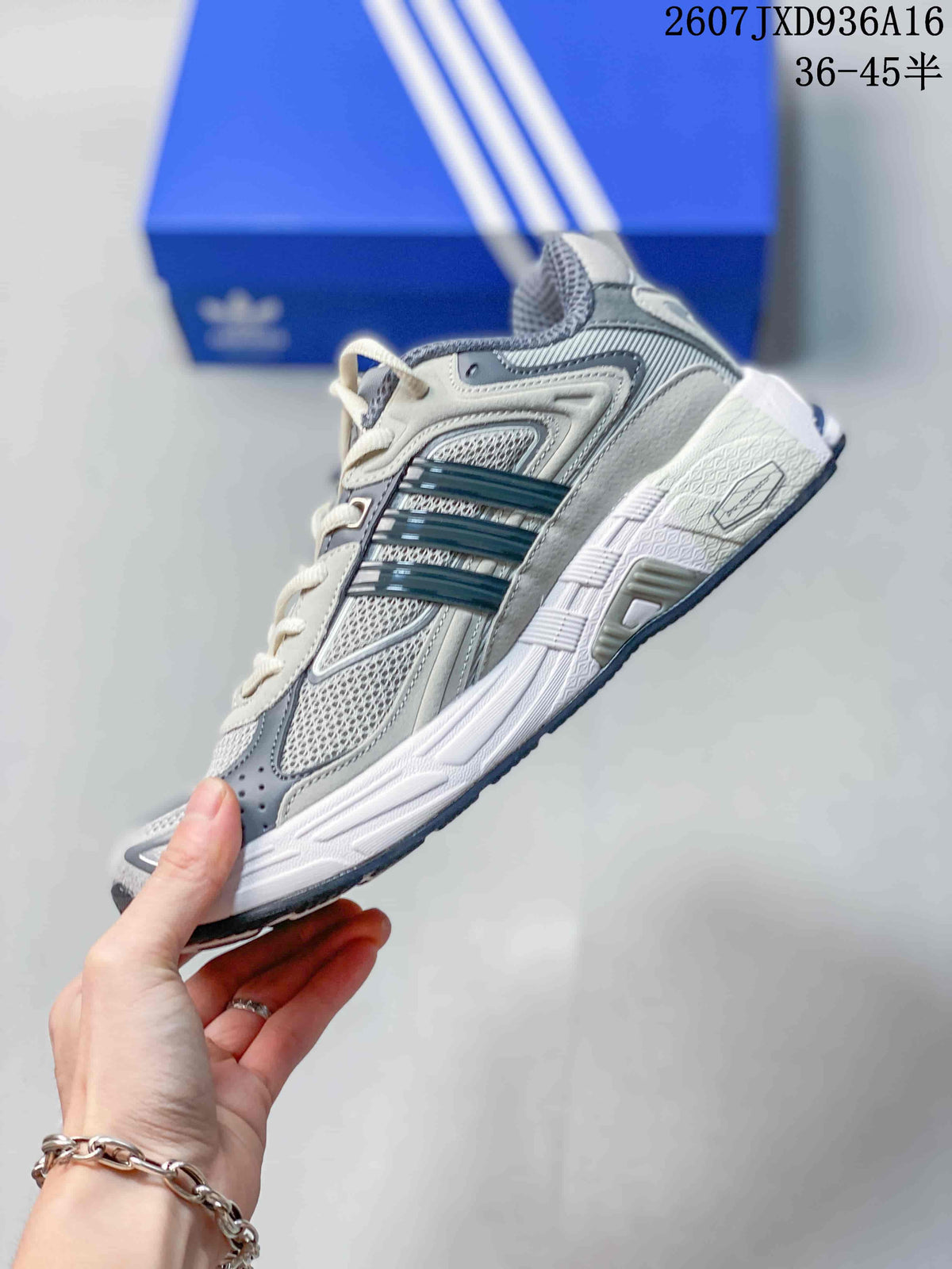Side view showing the cream and gray layered upper, mesh panels, three-stripe detailing, and sculpted midsole.