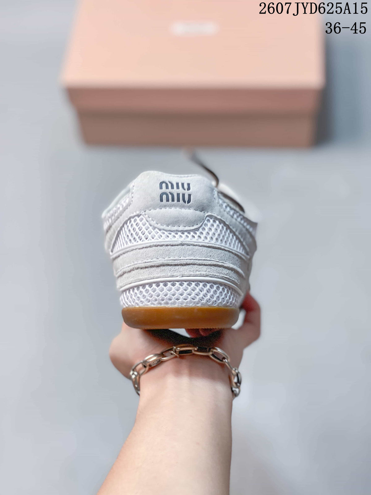 Rear view showing the layered heel construction, mesh sections, logo detail, and gum-colored heel edge.