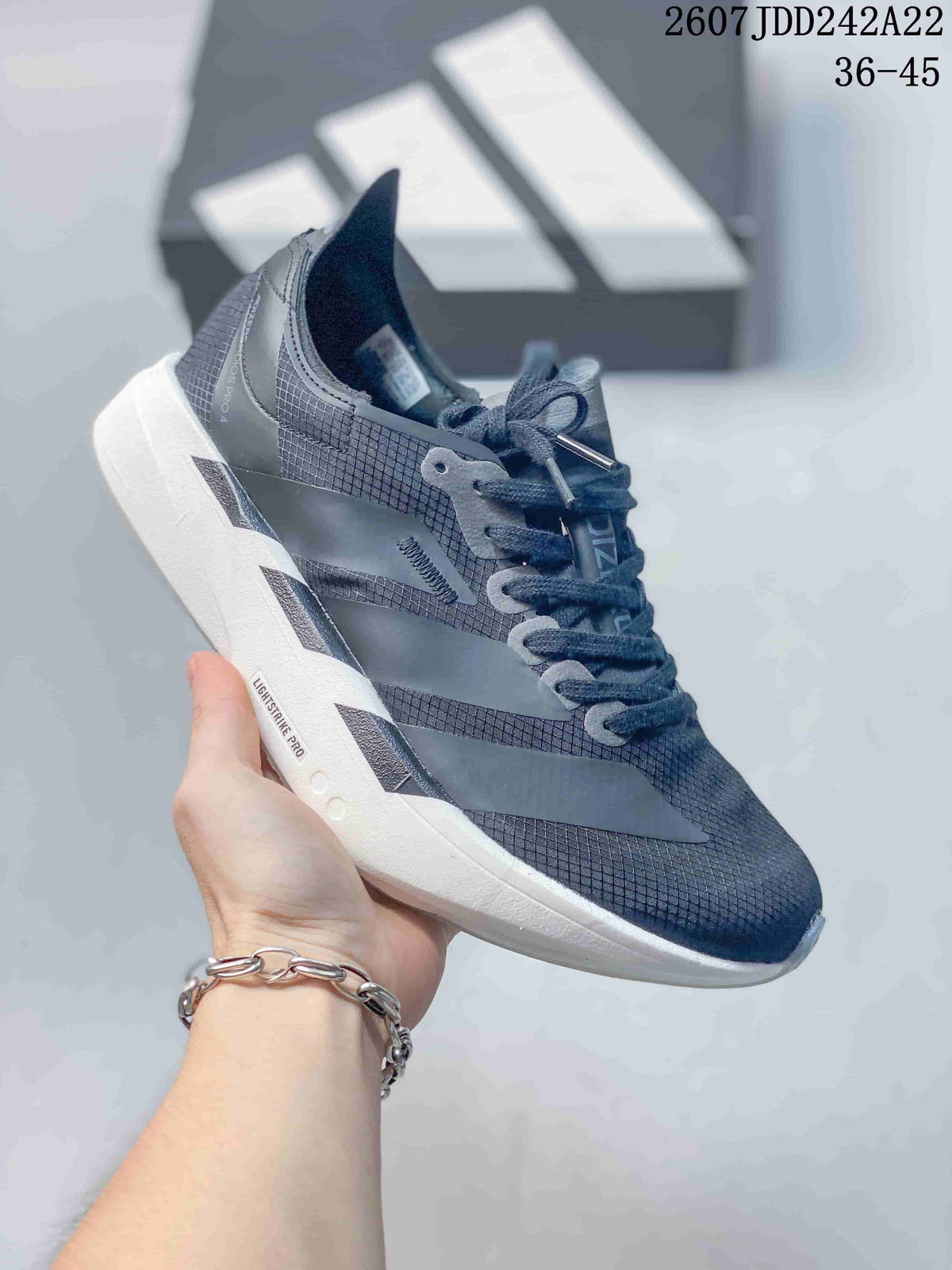 Dark gray Y-3 Adios Pro 4 sneaker with a white sole and reflective-looking side overlays; image text shows JDD242A22 and sizes 36–45.