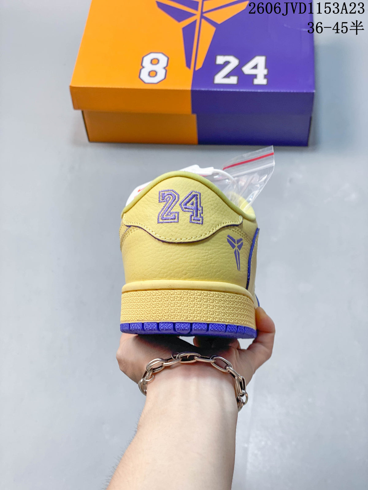 Rear view showing number 24 and Kobe-style graphics on the yellow sneaker