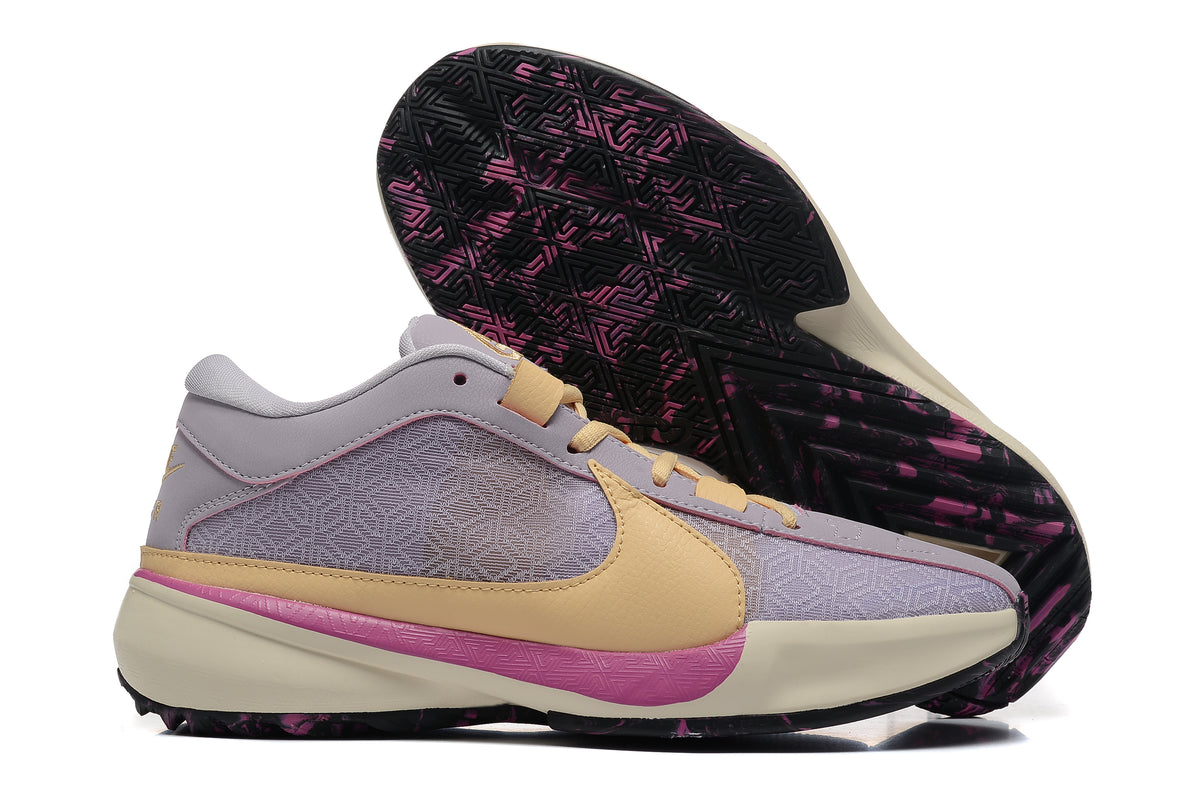 Lavender and pale yellow basketball shoes with pink accents and a patterned outsole.