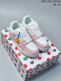 Pair of white and pastel pink Louis Vuitton sneakers displayed on a multicolor patterned box.