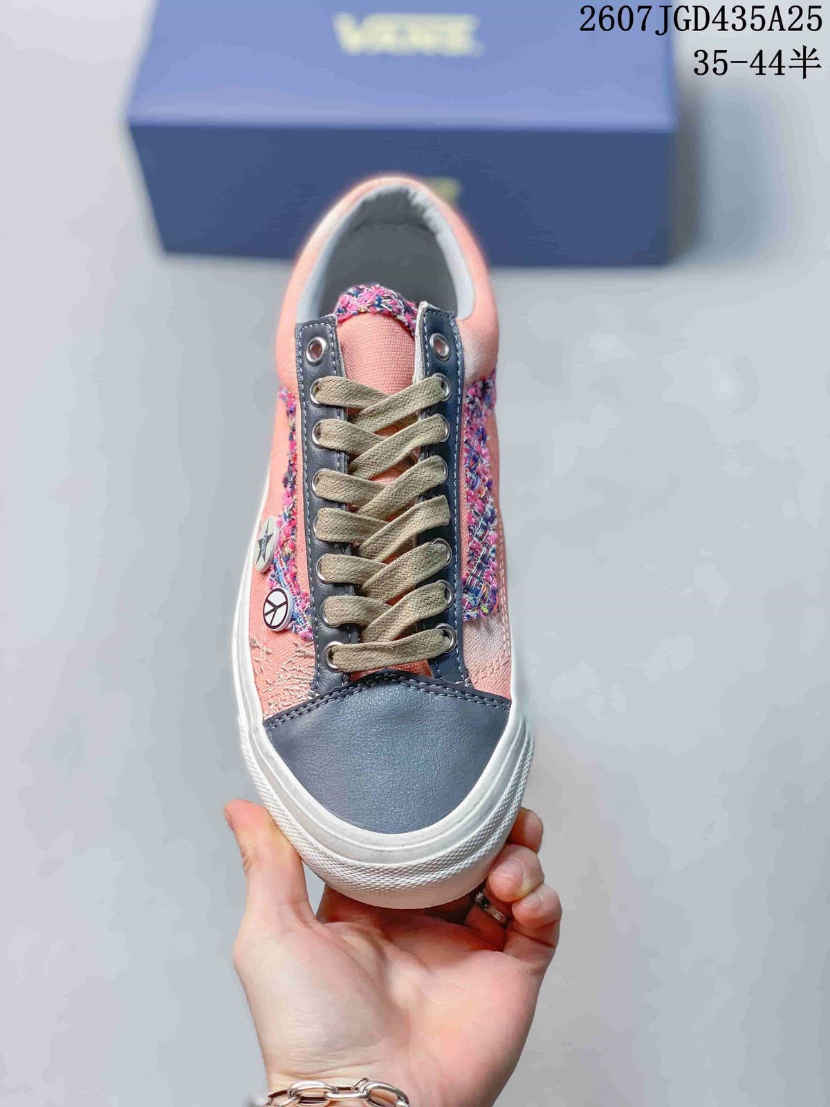 Top view showing the laces, navy toe panel, and decorative side elements
