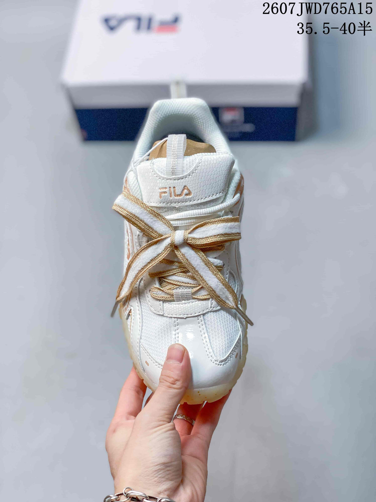 Top view of the FILA sneaker showing the padded collar, tongue branding, and layered laces.