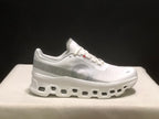 Close side view highlighting the tonal side branding and geometric sole openings.