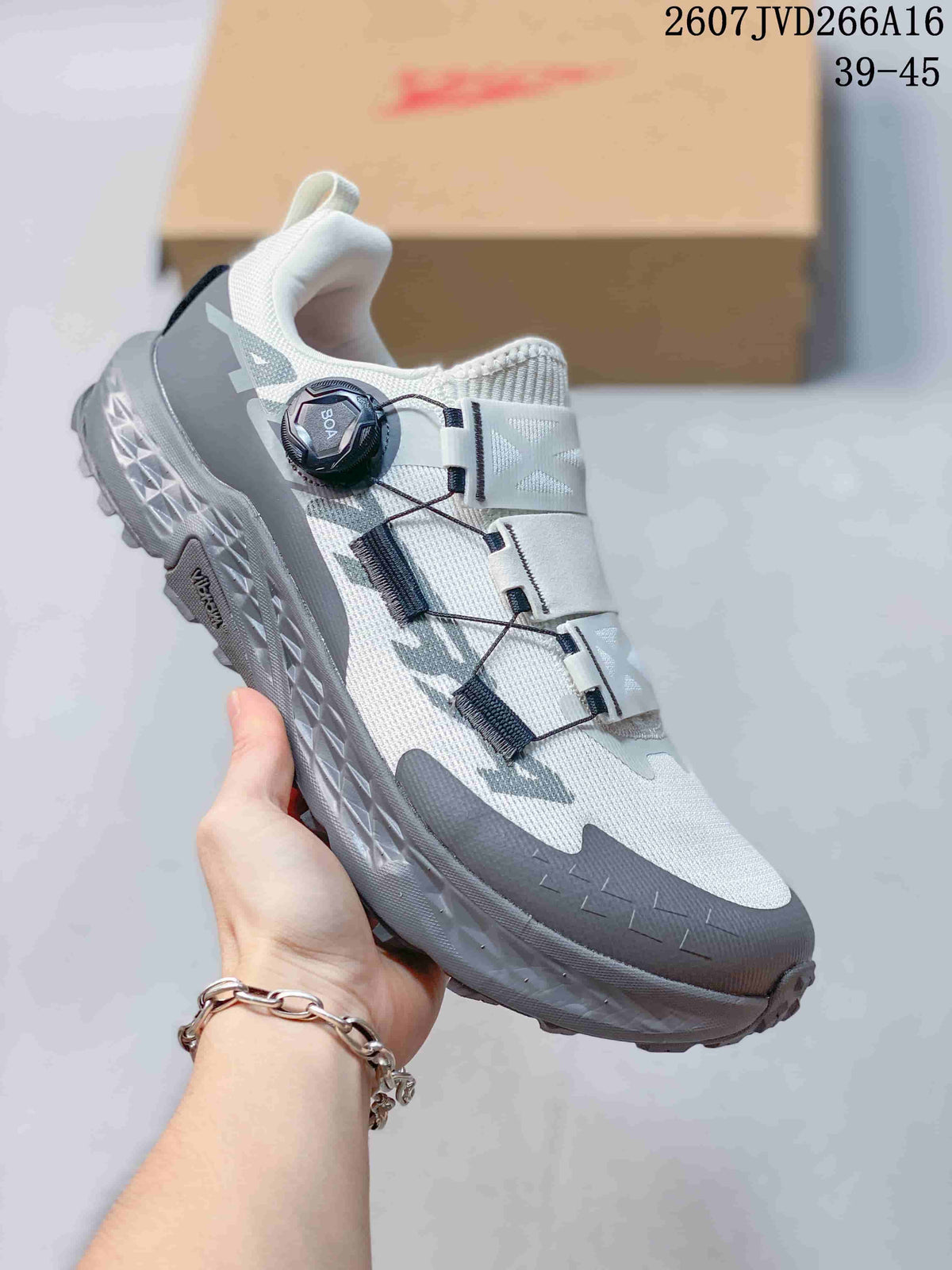 White and gray Altra TIMP 5 BOA trail running shoe shown from the side with a dark BOA dial and textured outsole.