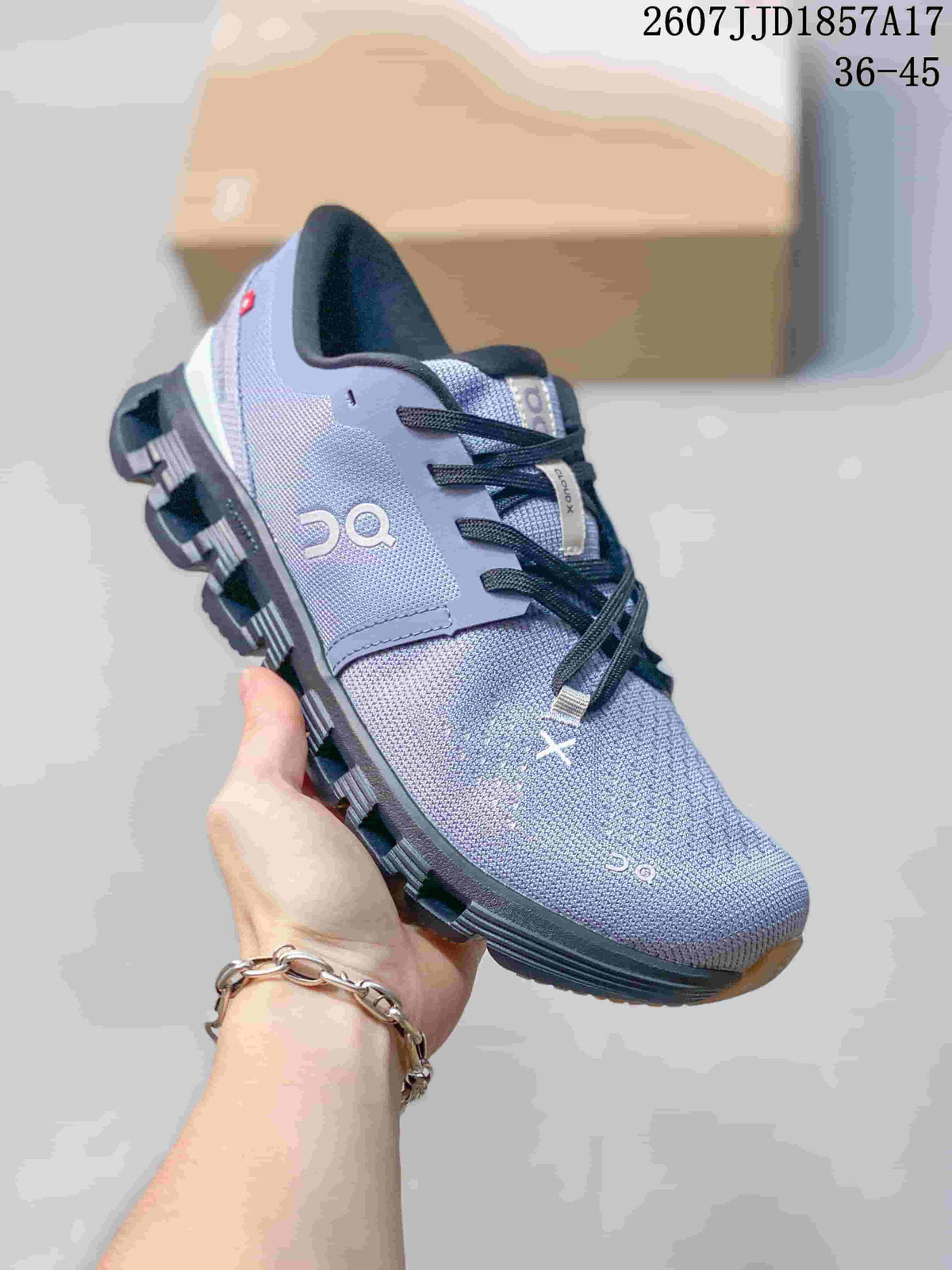 Close-up side view of a blue-gray On Cloud X 4 sneaker.