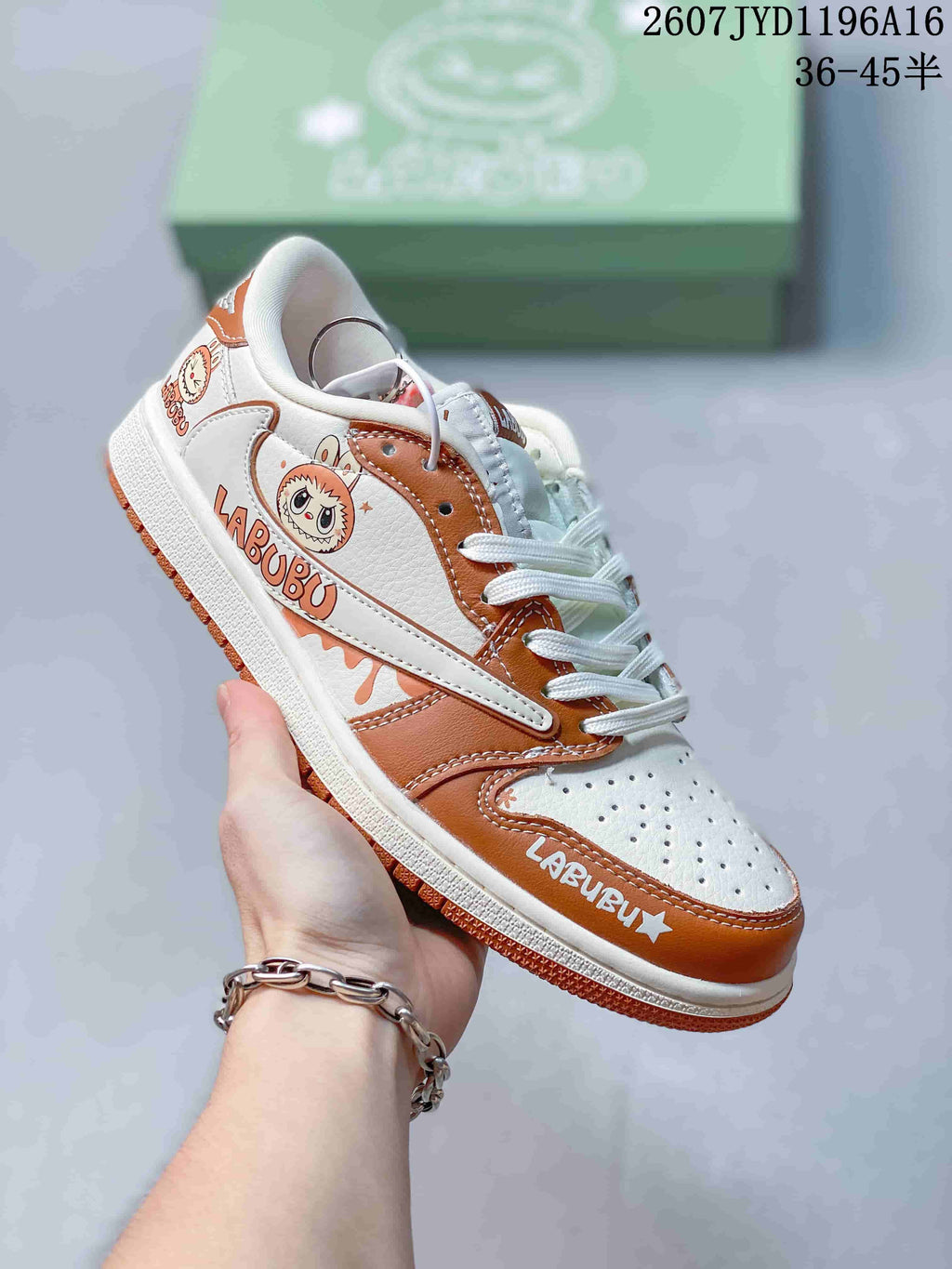 Angled side view showing Labubu character graphics, white side overlays, brown trim, and the low-top profile.