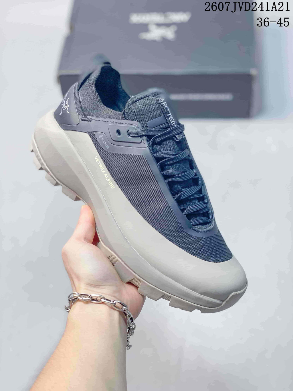 Angled side view showing the Arc'teryx branding, GORE-TEX marking, layered upper, and trail outsole.
