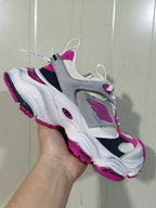 Angled close-up of the sneaker showing the Balenciaga branding, pink outsole details, layered upper and rear pull tab.
