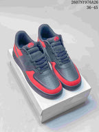 Pair of black and red Nike Air Force 1 '07 LV8 sneakers displayed on a shoebox.