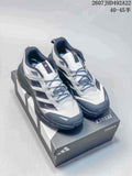 Pair of white, black and gray Adidas Terrex hiking shoes displayed on a Terrex shoe box.