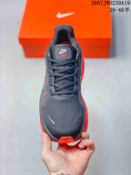Top view showing the lace-up front, textured dark upper, and tongue branding.
